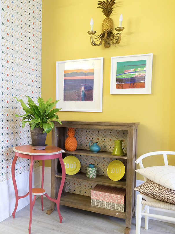 Living room with designer wallpaper and styling deco